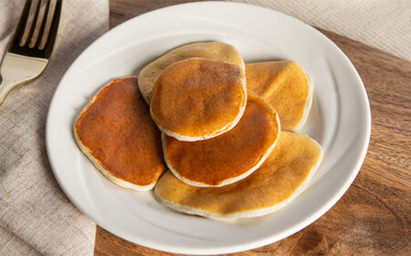 Meal replacement maple syrup pancakes on a white plate