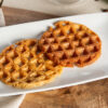 meal replacement maple syrup waffles on a white rectangular plate