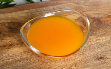 orange and mango jelly mix in a glass bowl