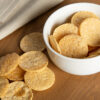 salt vingar popped chips in a white bowl and scattered on table