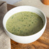 super green vegtable soup meal replacement in a white bowl