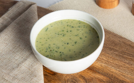 super green vegtable soup meal replacement in a white bowl